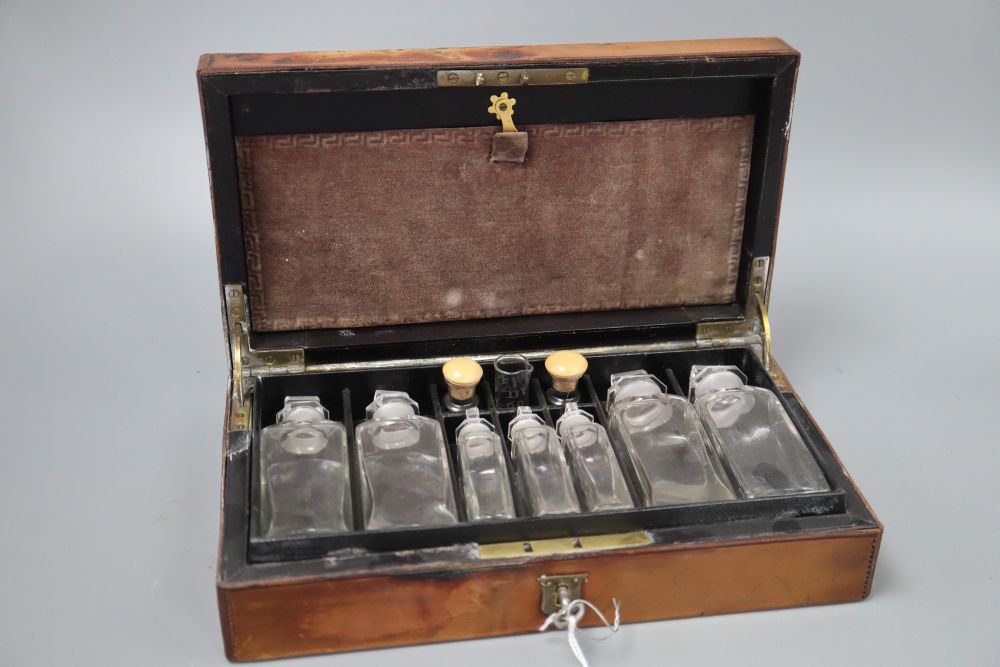 A leather cased travelling pharmacist box